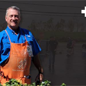 Mark Millia shown in Orange Apron with Red Cross Symbol.
