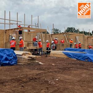 The Home Depot Foundation team members working on a building site.