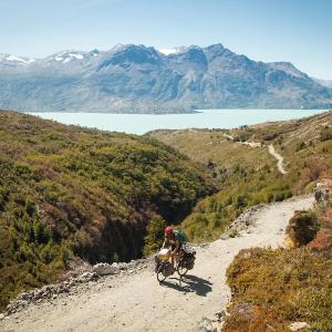 Thomas Allison photograph of a cyclist climbing a rugged mountain path on a bike.