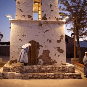 Thomas Allison photograph of nuns in front of a bell tower.