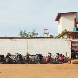 Thomas Allison photograph of bicycles parked next to a wall.