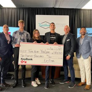Group of people holding a cheque awarded from Keybank