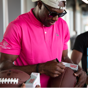 Terrell Owens signing football 