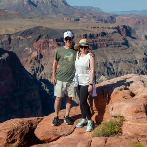 John Mulcahy and family member posed in a scenic natural area.