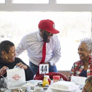 Johnny Little chatting with customers at his Southern-style breakfast and brunch restaurant Elicious in Ferguson, Missouri.