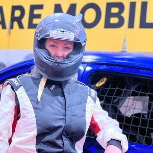 Alma Winkel, a commercial banker for U.S. Bank, outside her racing team’s vehicle.