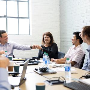people sitting at conference table 