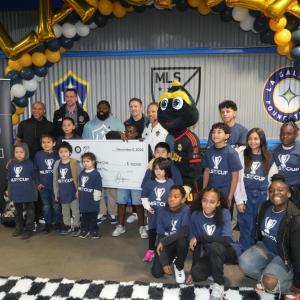 Jan Mirman, Senior Vice President, MLS Community Engagement, Tom Braun, President & COO, LA Galaxy, LA Galaxy alumni and MLS Greats Cobi Jones and Robbie Keane presented the East Side Riders Bike Club with a check donation.