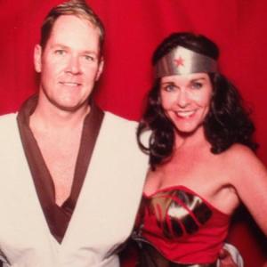 Erica Opstad dressed as Wonder Woman for a Halloween party and her husband Keith.