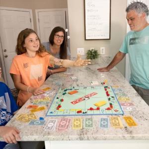 family playing monopoly 