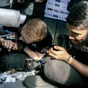 motorsport engineers working together