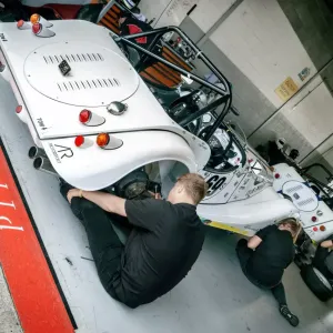 motorsport engineers working on a car