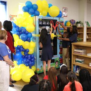 People cutting a ribbon