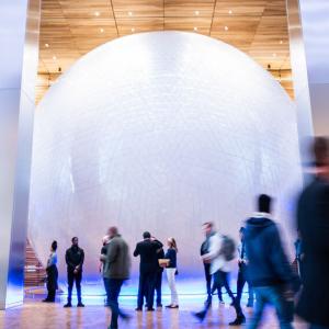 The Universal Sphere and many people walking around.