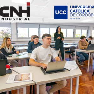 Students sat at desks using laptops
