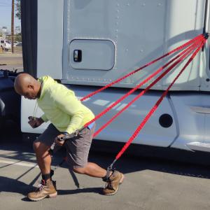 Using exercise bands tied to a truck