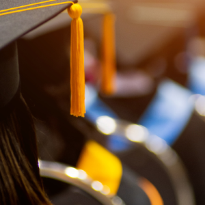 Wesco VOLT Scholarship program. Graduate shown in cap and gown.