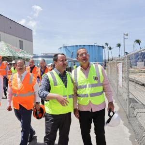 Workers in hi-visibility vests at Bacardi rum distillery