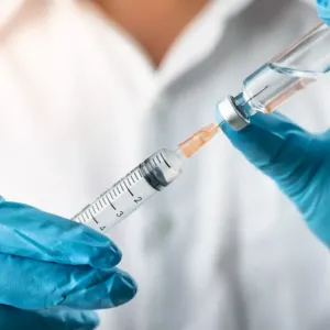health professional preparing a vaccine 