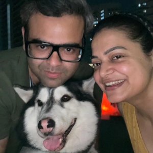 Vedant, his wife and their husky.
