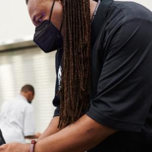 Media specialist Dairren Gibson demonstrates an app on one of Mater Academy East’s new devices. Credit: Saeed Rahbaran
