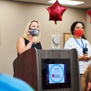 Principal Renee Fairless and Verizon Innovative Learning coach Olga Storla address the school community during the device rollout. Credit: Saeed Rahbaran