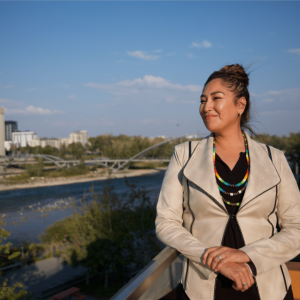 Veronica Big Plume outside overlooking a river