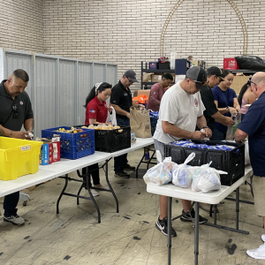 Volunteers packing food bags for homeless individuals and other people in need across the city.