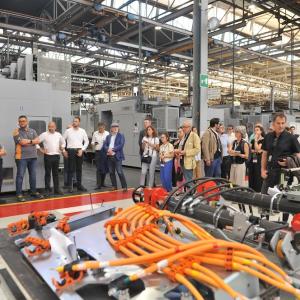 group standing inside plant