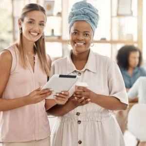 Two people stood next to each other smiling 