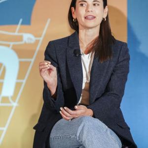 One person sitting on a chair talking