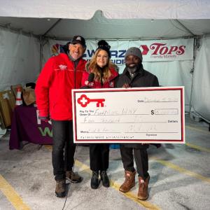 KeyBank and WGRZ Food 2 Families representatives shown with a $5,000 grant check..