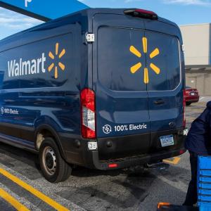 person packing an electric Walmart van