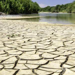 Dry land with water in the distance