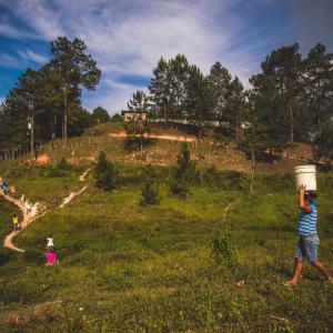 People carrying water bucket