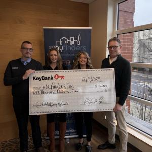 Photo caption: (from left) KeyBank leaders Greg Mularki, Branch Manager; Analisha Michanczyk, Corporate Responsibility Officer; and Tracy Menges,  Regional Community Sales Manager present a grant check to Way Finders Chief Development Officer John Bidwell.