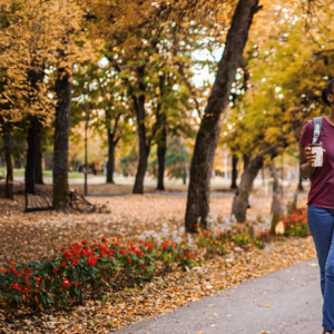 Aflac: Wellness Matters logo. Young family shown with a toddler in a stroller.