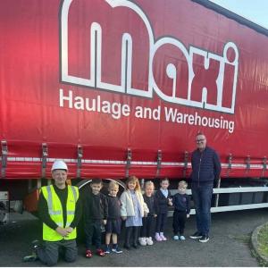 Picture: Children from St Aidan’s with William Story (Maxi) and Graeme Wands (Wesco Anixter) with Maxi van.