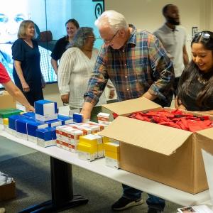 Wesco volunteers packing supplies for donations.