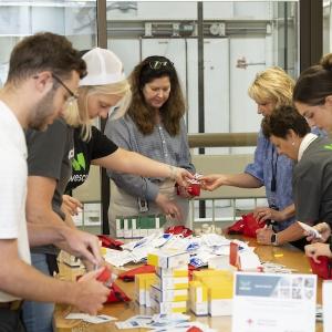 Wesco volunters sorting supplies prior to packing them.