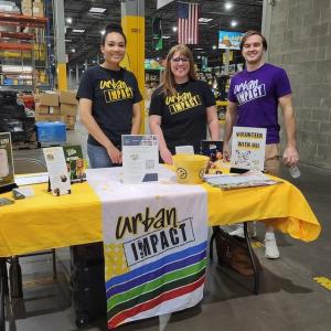 Wesco volunteers at an Urban Impact booth.