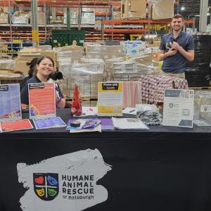 Humane Animal Rescue booth set up in the Wesco warehouse.