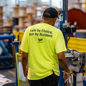 Wesco employee shown wearing a shirt that states: Safe by choice, not by accident.