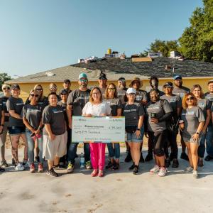 Wesco team with donation check for Habitat.