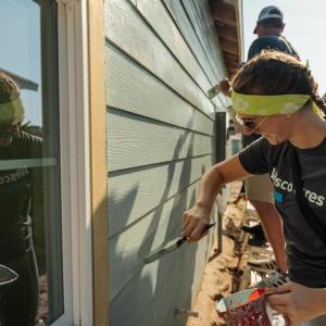 Wesco team member painting.