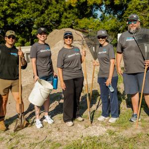 Wesco team members doing yardwork.