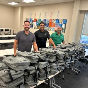 Team members at Wesco shown with backpacks.
