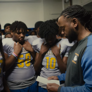 Westinghouse Academy football team receiving a grant.