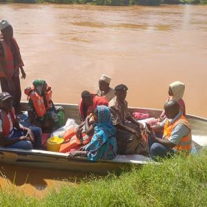 In Tana River, people use boats to travel on flooded roads.