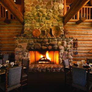 Dining tables in front of a fireplace